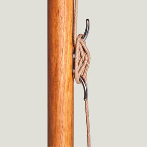 Hardwood parasol pole detail with stainless steel cleat and rope