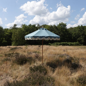 Turquoise parasol with fringe