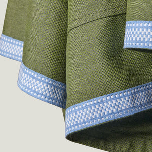 up close green parasol fabric with blue trim